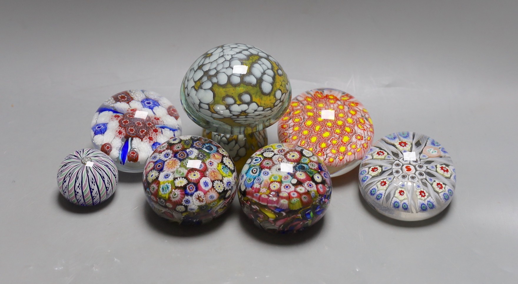 A selection of seven art glass paperweights